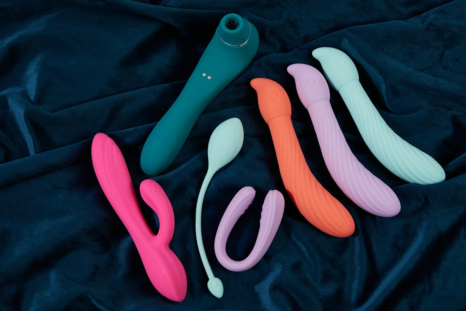 A couple holding a vibrator together, symbolizing modern intimacy and communication