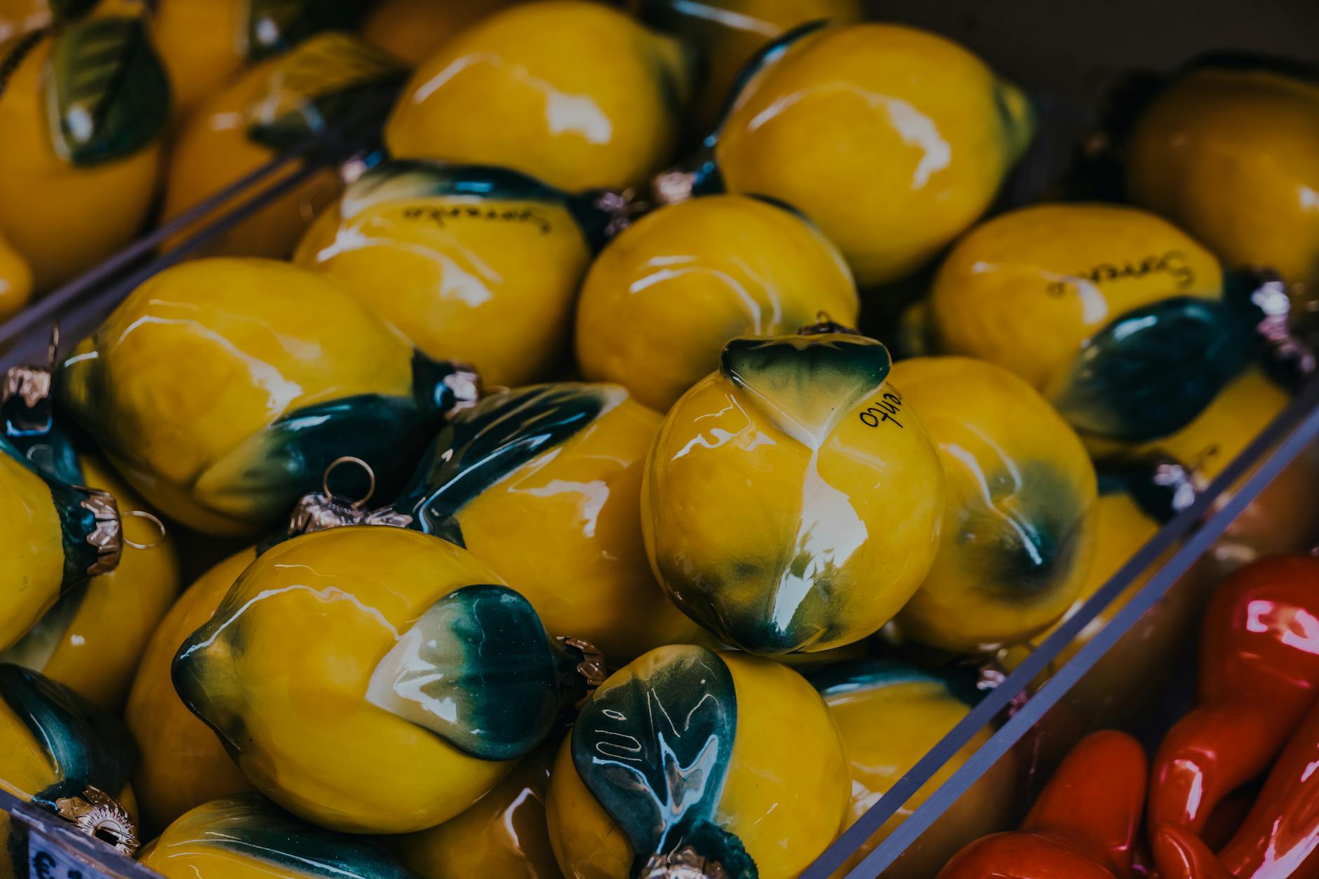 Vibrant yellow ceramic lemons arranged carefully, symbolizing intentional healing and renewal
